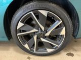 a close up of a wheel on a blue car