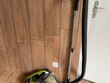 a vacuum that is sitting on the floor next to a door