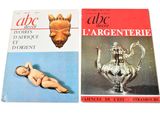 two books of art and antiques on a white surface