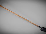 a close up of a wooden handled shovel on a gray background