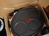 a box with a speaker inside of it on the floor