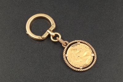 gold plated key chain with a coin in the center