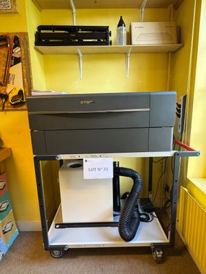 a machine that is sitting on a cart in a room