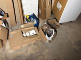 a pile of boxes and a refrigerator in the corner of a room