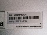 a label on the back of a laptop with a barcode on it
