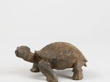 figurine of a tortoise on a white background