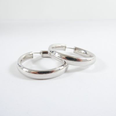 two silver rings on a white surface with a white background