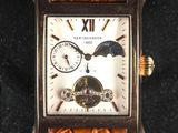 an image of a close up of a wrist watch with a brown leather band