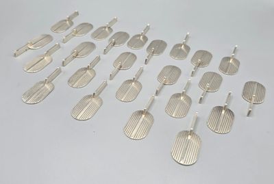 a lot of silver spoons that are on a table