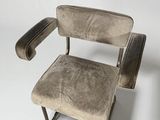 a chair that is sitting on a white surface