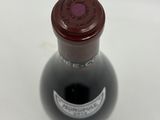a bottle of wine that is sitting on a table