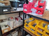 many boxes and bins on the shelves in the room