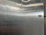 a stainless steel refrigerator that is in a kitchen