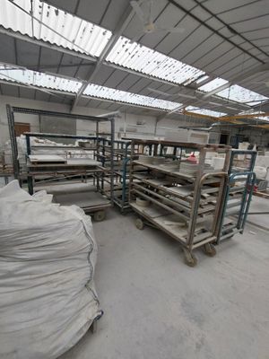 a large warehouse filled with lots of shelves and pallets