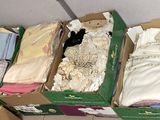 several boxes of clothing are stacked on top of each other