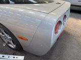 a silver sports car parked in a parking lot