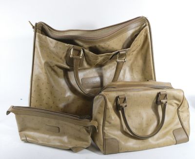 three pieces of luggage sitting next to each other on a white surface