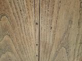 a close up of a wooden cabinet with a clock on it