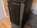 a black desktop computer sitting on top of a wooden floor