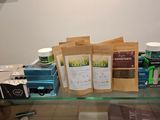 a glass shelf with a variety of tea bags on it