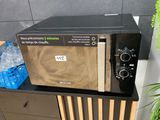 a microwave that is sitting on top of a cabinet