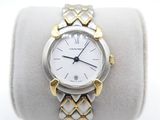 an image of a woman ' s watch on a white and gold bracelet