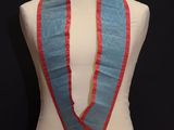 an image of a mannequin with a blue and red scarf