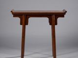 a small wooden table with two legs and a wooden top