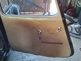 a door of a car that has a handle on it