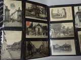 a person holding a book with pictures of old buildings on it