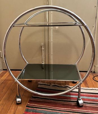an image of a chrome and glass table