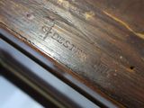 a close up of a piece of wood with writing on it