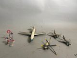 a lot of toy airplanes that are laying on the floor