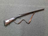 a rifle that is laying on the ground