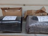 two rolls of duct tape sitting on a table next to a box