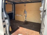 a white van with a wooden door and a brown floor