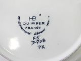 a white plate with a black and white design on it