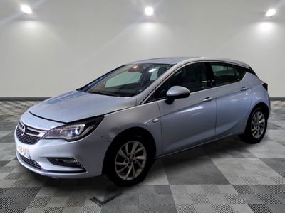 the new opel is parked in a large room with checkered flooring