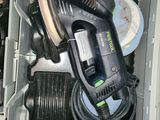 a box with a sander and other tools inside of it