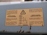 a sign on the side of a machine indicating that it is not working