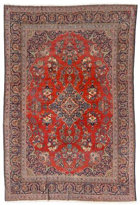 un tapis rouge avec un motif de médaillon sur fond blanc