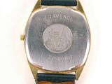 a watch that is sitting on top of a brown strap