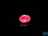 a pink diamond on a black background
