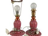 pair of red and gold table lamps with white lampshads
