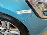 a blue car with a sticker on the front of it