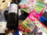 a bottle of wine sitting on a table next to a bunch of books
