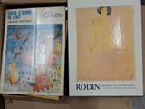 two books in a box one is a painting and the other is a painting