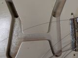 a close up of an electric guitar that is being worked on