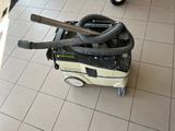 a vacuum that is sitting on the floor in the room