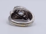 silver ring with a horse ' s head and a diamond in the center